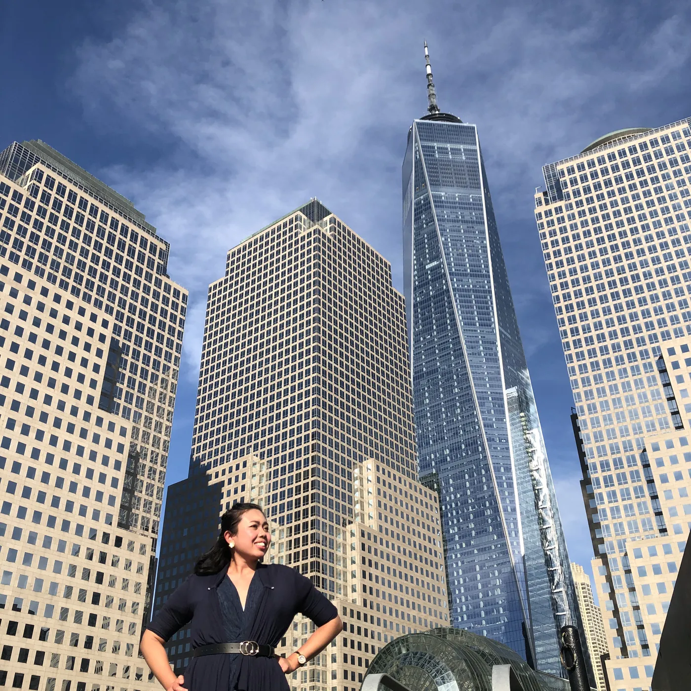 Krittaya standing confidently among city skyscrapers